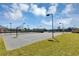 Basketball court with lighting, ready for evening games and neighborhood recreation in a well maintained area at 515 Mickleton Loop, Ocoee, FL 34761