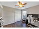 Bedroom with a closet and window next to a desk and chair, well suited for work or relaxing at 515 Mickleton Loop, Ocoee, FL 34761