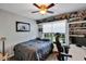 Comfortable bedroom featuring hardwood floors, natural lighting, and unique decor accents at 515 Mickleton Loop, Ocoee, FL 34761