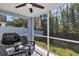 Enjoy outdoor living on this screened patio with seating and barbecue grill at 515 Mickleton Loop, Ocoee, FL 34761