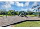 Community playground features swings and a slide, providing children with opportunities for fun and exercise at 515 Mickleton Loop, Ocoee, FL 34761