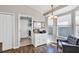 Inviting sitting area featuring a bay window and a decorative cabinet near a laundry room at 515 Mickleton Loop, Ocoee, FL 34761