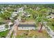 An aerial view shows the home's placement in a lush, tree-filled community at 5227 Orange Ave, Port Orange, FL 32127