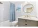 Elegant bathroom with tiled shower and gray vanity at 5238 Baskin St, Orlando, FL 32814