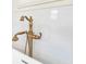 Bright bathtub with bronze fixtures and white tile surround at 5238 Baskin St, Orlando, FL 32814