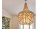 Bright dining room featuring a beaded chandelier and a view of the garden from the window at 5238 Baskin St, Orlando, FL 32814