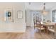 Bright dining area featuring a beaded chandelier, a round wooden table with chairs, and luxury decor at 5238 Baskin St, Orlando, FL 32814