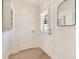 Bright entryway features beautiful hardwood floors, and white painted doors at 5238 Baskin St, Orlando, FL 32814