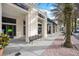 A sidewalk with shops in a waterfront plaza, featuring benches and palm trees along the walkway at 5238 Baskin St, Orlando, FL 32814