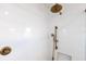 Bright shower with bronze shower head and white tile surround at 5238 Baskin St, Orlando, FL 32814