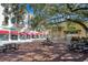 Charming town center with shops, restaurants, and outdoor seating under shady trees at 5238 Baskin St, Orlando, FL 32814