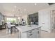 Open-concept dining area with modern light fixture and access to outdoor living space at 6312 Dew Drop Loop, St Cloud, FL 34771