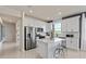 Well-lit kitchen featuring modern appliances and ample counter space with bar stool seating at 6312 Dew Drop Loop, St Cloud, FL 34771