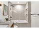 Bright bathroom featuring neutral tile and a combined shower and tub at 724 Lake Davis Dr, Orlando, FL 32806