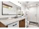 Stylish bathroom with a glass-enclosed shower and marble countertops at 724 Lake Davis Dr, Orlando, FL 32806