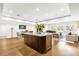 Bright living room featuring hardwood floors and an open concept, showing the living, dining, and kitchen spaces at 724 Lake Davis Dr, Orlando, FL 32806