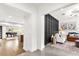 Open-concept view of kitchen and living room with a view of a stylish black accent wall at 724 Lake Davis Dr, Orlando, FL 32806