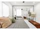 Bedroom featuring a mirrored wall reflecting the bed, white bedding, and neutral decor at 724 Lake Davis Dr, Orlando, FL 32806