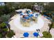 A playful community water park offers a colorful splash pad, slides, and nearby lounge areas for relaxation and fun at 7838 Spectrum Dr, Kissimmee, FL 34747