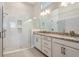 Modern bathroom with a tiled glass shower and marble countertops at 889 Megano Blvd, Deland, FL 32724