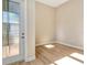 Entryway featuring wood floors and a modern paneled front door at 889 Megano Blvd, Deland, FL 32724