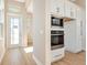 Stylish kitchen featuring stainless steel appliances and plenty of cabinet storage at 889 Megano Blvd, Deland, FL 32724