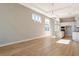 Spacious living room and kitchen area featuring wood floors and recessed lighting at 889 Megano Blvd, Deland, FL 32724