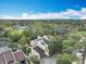 An aerial view showcases the property's position amidst verdant trees at 102 Tomoka Trl # 102, Longwood, FL 32779