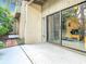 Private patio offers a tranquil view with sliding glass doors leading to the interior at 102 Tomoka Trl # 102, Longwood, FL 32779