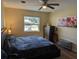 Comfortable bedroom with a ceiling fan, a large window and tasteful decor at 103 Brown Dr, Sanford, FL 32773