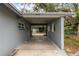 Spacious carport providing covered parking and access to the backyard and storage at 103 Brown Dr, Sanford, FL 32773