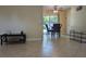 Open-concept dining area with tile floors and a table for four at 103 Brown Dr, Sanford, FL 32773