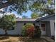 Inviting home exterior enhanced by a well-maintained lawn and colorful greenery at 103 Brown Dr, Sanford, FL 32773
