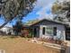 Charming single-story home featuring neutral paint, complimented by mature trees and a well-manicured front yard at 103 Brown Dr, Sanford, FL 32773