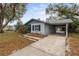 Single story home with covered parking and a well-maintained front yard at 103 Brown Dr, Sanford, FL 32773