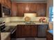 The beautiful kitchen has stainless steel appliances and stylish cabinetry at 103 Brown Dr, Sanford, FL 32773