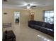 Spacious living room featuring neutral paint, tile floor, and fan at 103 Brown Dr, Sanford, FL 32773