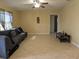 Bright living room features neutral paint, tile floor, and comfortable sofa at 103 Brown Dr, Sanford, FL 32773