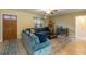 Comfortable living room with a plush sectional couch, a cat tree, and a well-lit space at 103 Brown Dr, Sanford, FL 32773