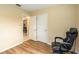 The room features neutral walls, wood flooring, and two white doors, offering a versatile space at 103 Brown Dr, Sanford, FL 32773