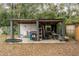 Practical outdoor shed providing ample storage space, a shaded area, and potential for various uses at 103 Brown Dr, Sanford, FL 32773