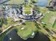 Community clubhouse surrounded by a golf course, putting green, and driving range at 10912 Mobberley Cir, Orlando, FL 32832