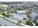 Community pool area featuring a splash pad, playground, and covered seating at 10912 Mobberley Cir, Orlando, FL 32832