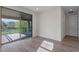 Bright bedroom with sliding glass doors that open to a covered outdoor living area at 10912 Mobberley Cir, Orlando, FL 32832
