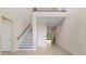 Open foyer with a staircase, hallway, and a view to the backyard at 10912 Mobberley Cir, Orlando, FL 32832