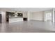 Open kitchen showcasing dark cabinetry, modern fixtures, and expansive tile flooring at 10912 Mobberley Cir, Orlando, FL 32832