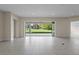 Spacious room with sliding glass doors leading to a patio and backyard at 10912 Mobberley Cir, Orlando, FL 32832