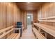 Inviting sauna room featuring wooden benches and walls, creating a relaxing and spa-like experience at 10912 Mobberley Cir, Orlando, FL 32832