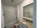 Clean bathroom featuring a tub and shower, granite countertop vanity, and ample lighting at 1463 Riverboat Dr, Kissimmee, FL 34744