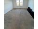 Spacious carpeted bedroom with a window providing natural light and backyard views at 1463 Riverboat Dr, Kissimmee, FL 34744
